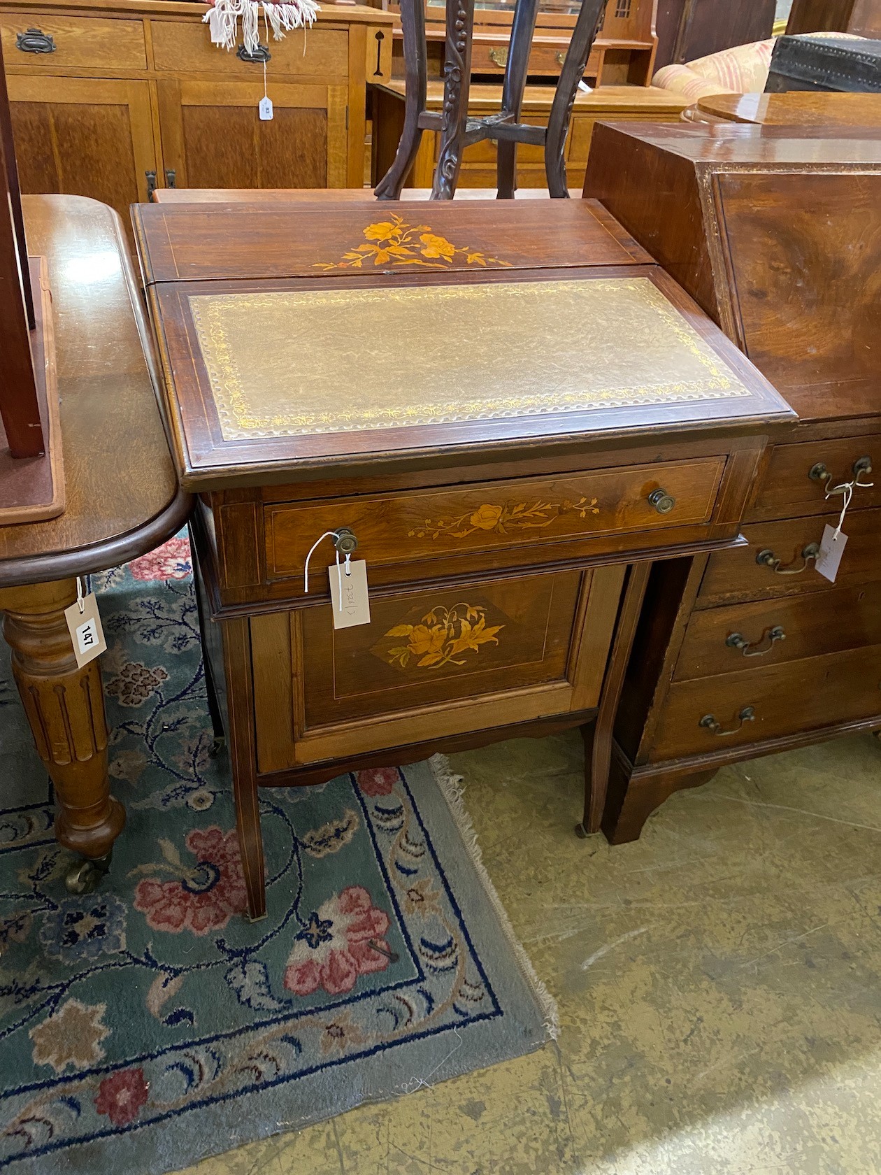 A late Victorian marquetry inlaid mahogany Davenport with Patent rising action, width 60cm, depth 50cm, height 87cm